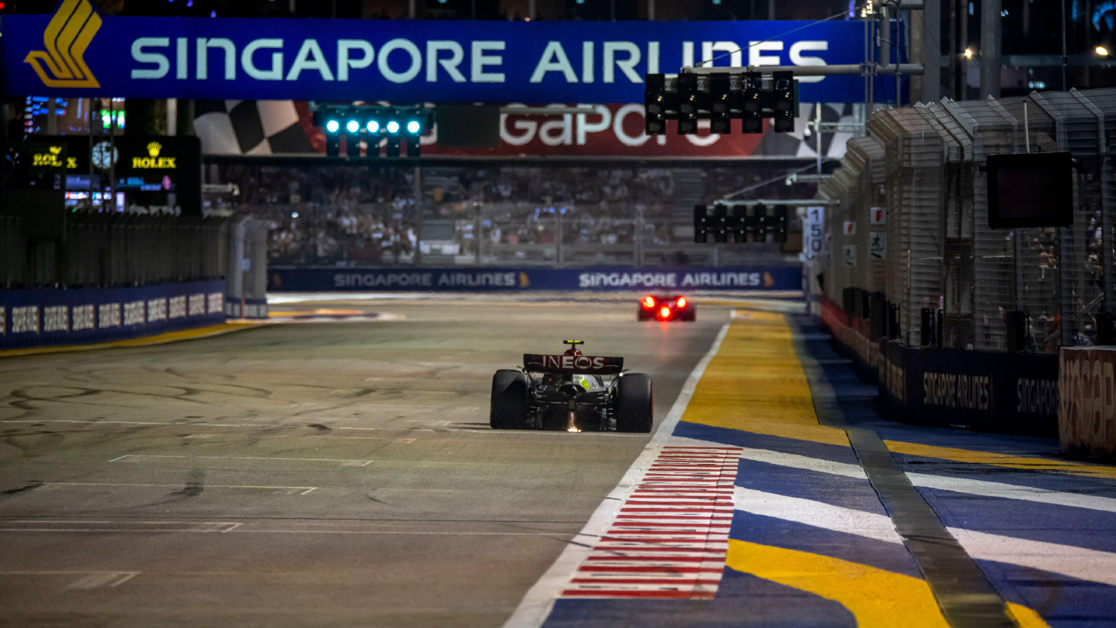 Singapore: Lewis Hamilton drives his Mercedes W13 across the start/finish line at Marina Bay.