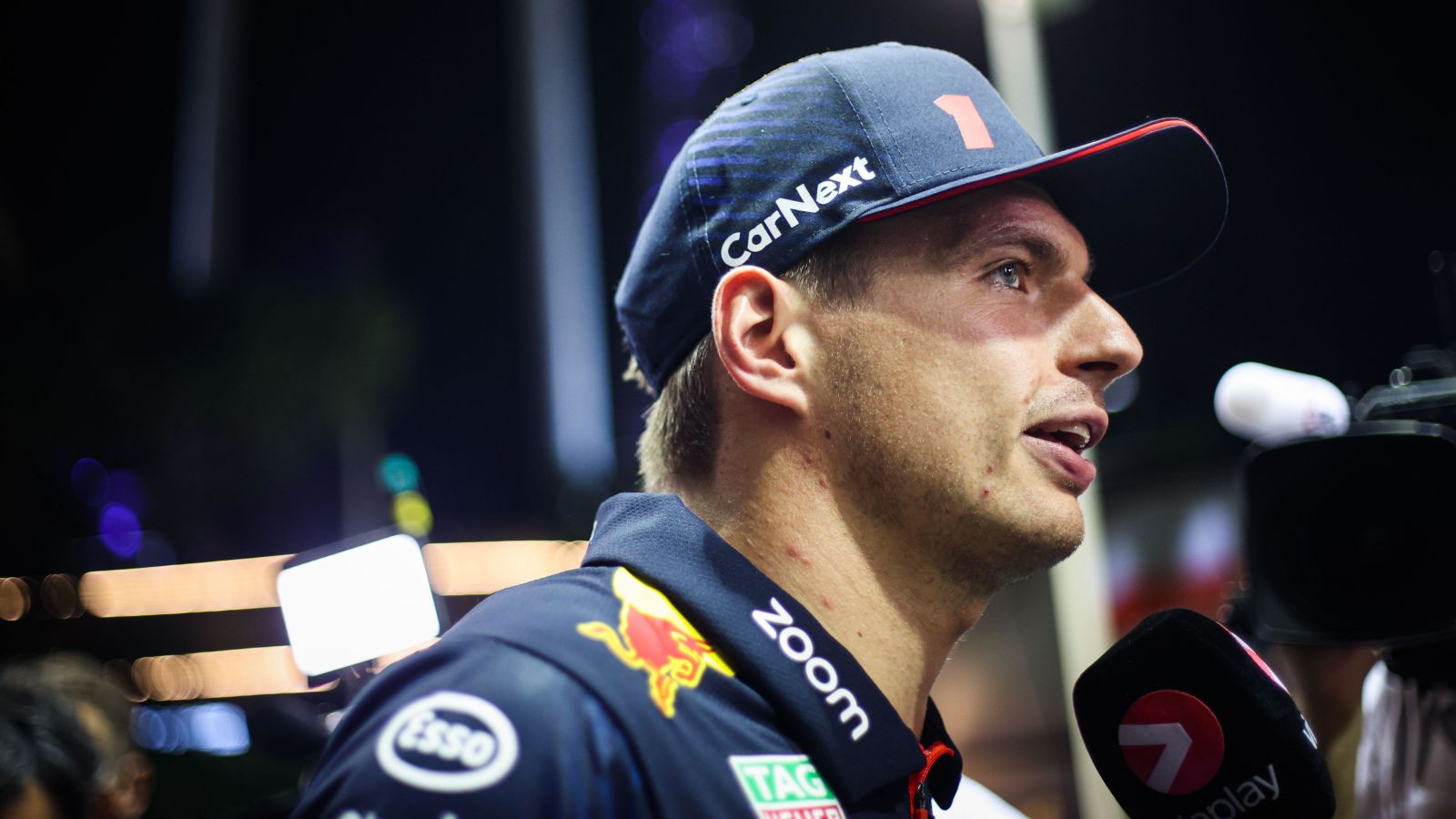Red Bull driver Max Verstappen speaks to the media at the 2023 Singapore Grand Prix.