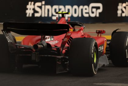 Carlos Sainz flies past the Singapore Grand Prix signage.