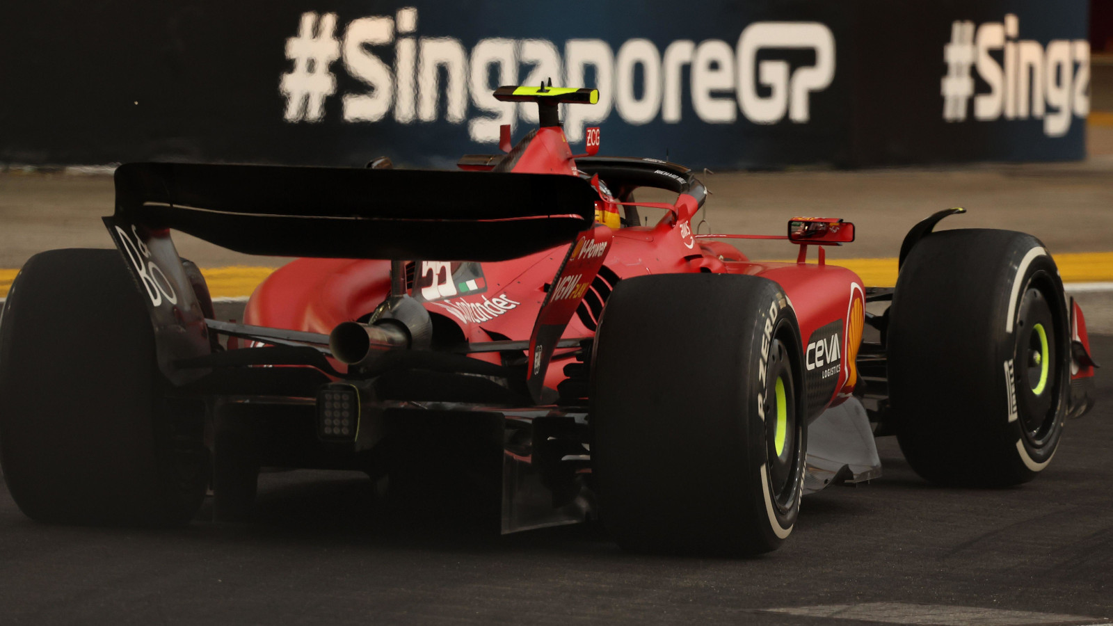 Carlos Sainz flies past the Singapore Grand Prix signage.