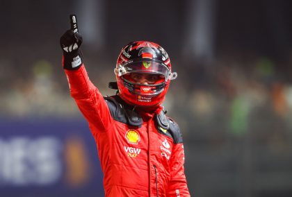 Ferrari driver Carlos Sainz finger raised in celebration.