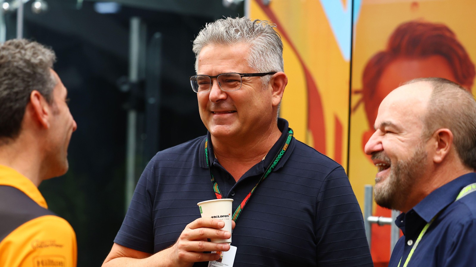 Gil de Ferran and McLaren team boss Andrea Stella speak at the 2023 Brazilian Grand Prix.
