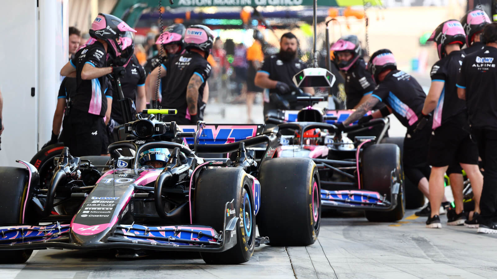 Alpine F1 drivers pull into the pits with Pierre Gasly ahead of Esteban Ocon