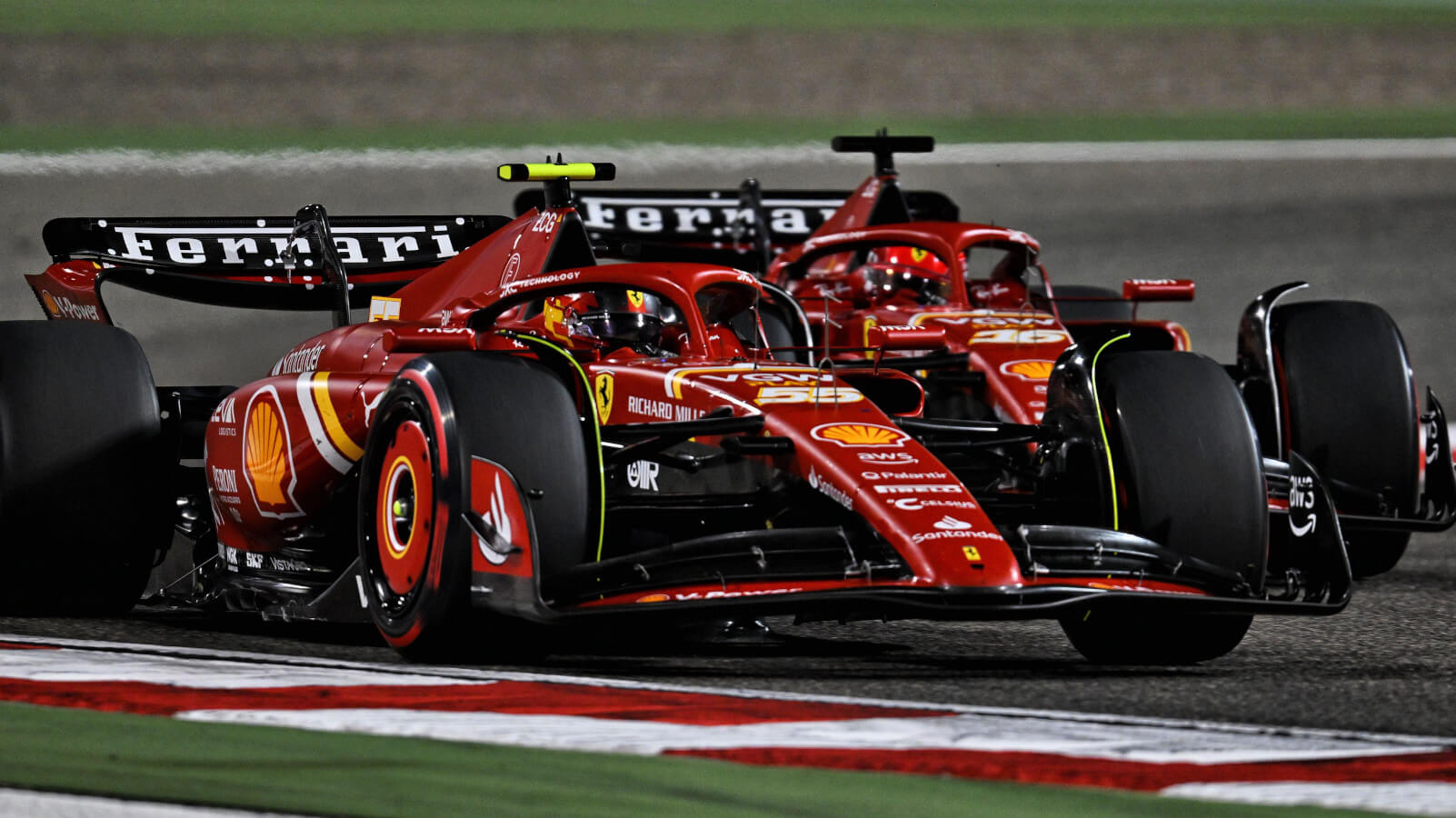 Carlos Sainz racing Charles Leclerc