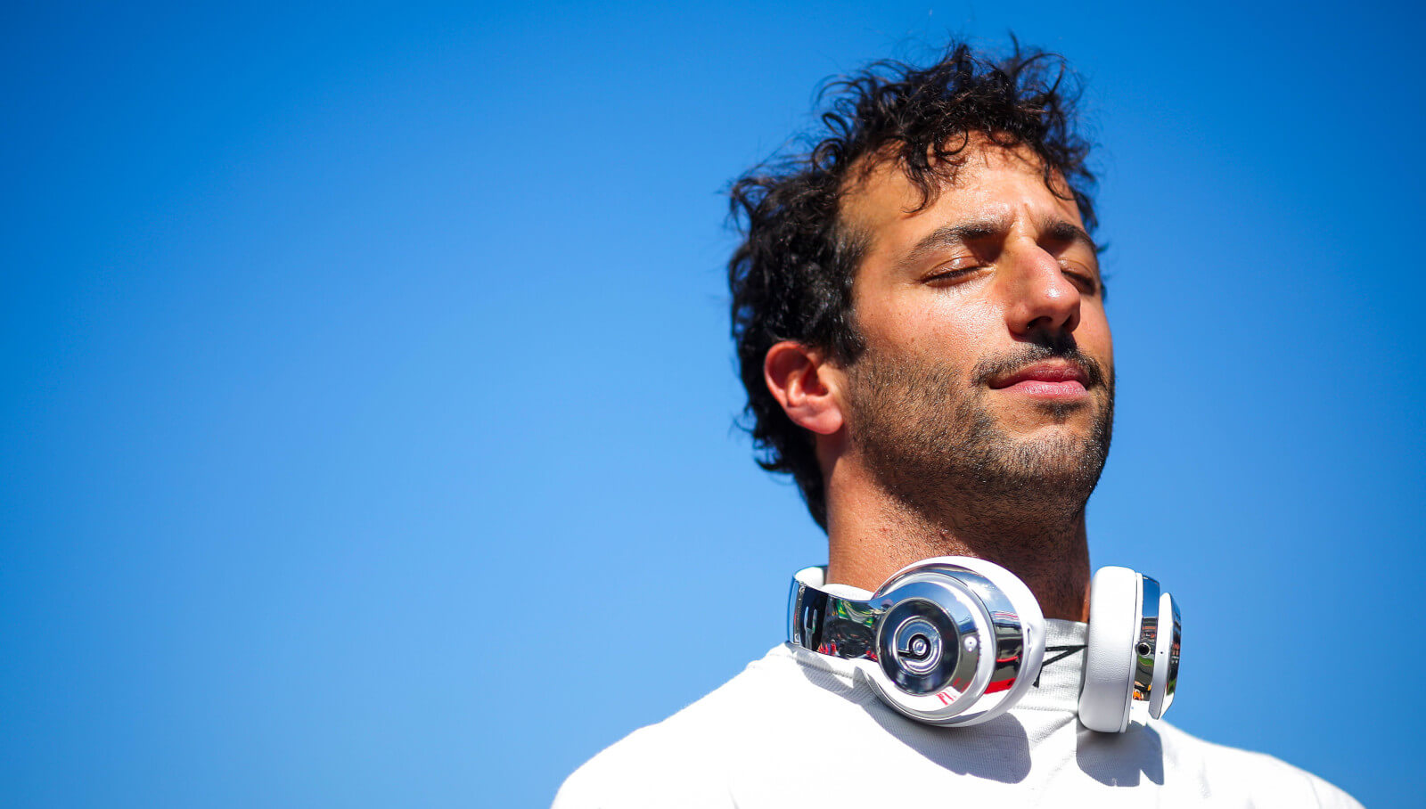 RB driver Daniel Ricciardo with his eyes closed on the grid