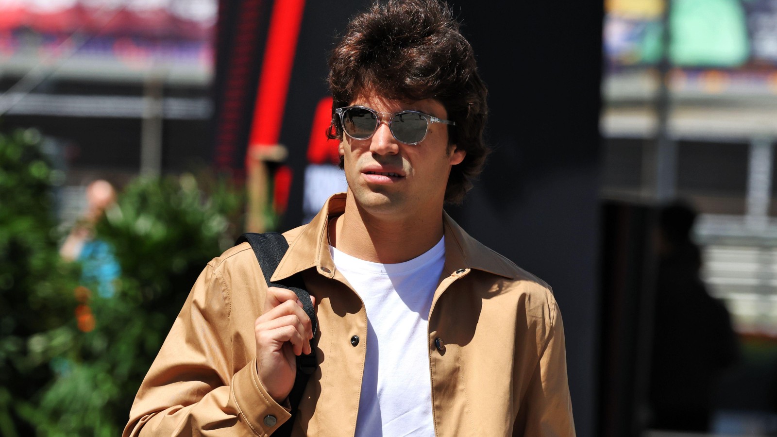 Aston Martin driver Lance Stroll in street clothes at the 2024 Chinese Grand Prix.