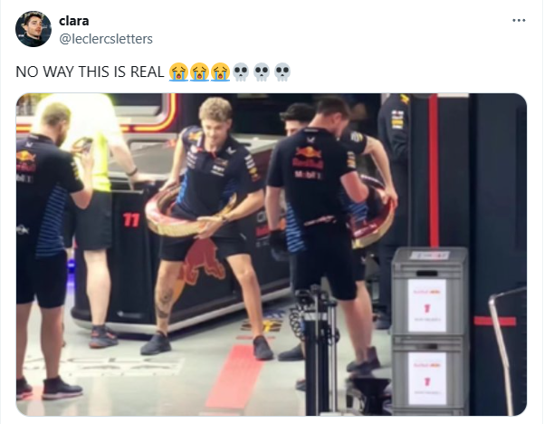 Red Bull mechanics hula hooping with their 2024 Chinese Grand Prix trophies.