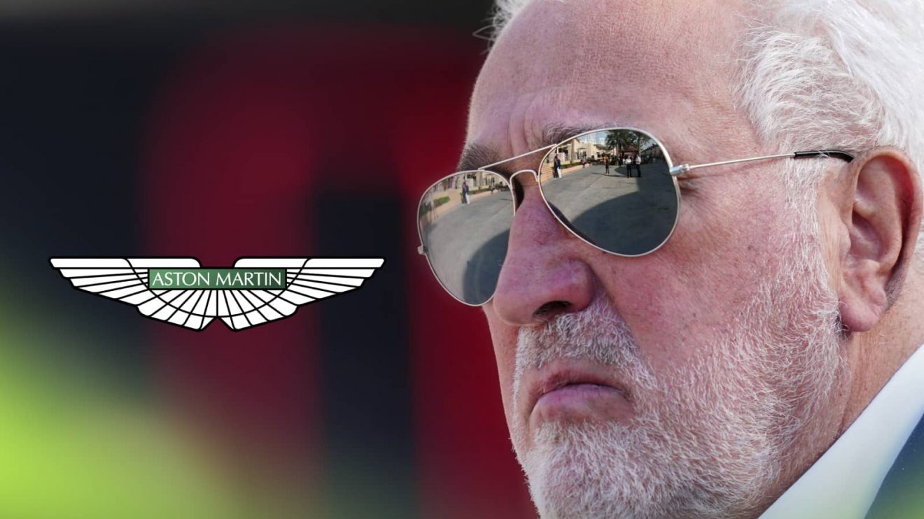 A close-up shot of Lawrence Stroll with a prominent Aston Martin logo alongside him