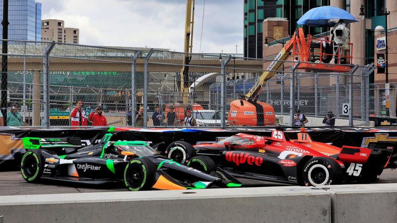 The No. 45 RLL Honda of Christian Lundgaard crashes on top of Romain Grosjean's No. 77 at the 2024 Detroit Grand Prix