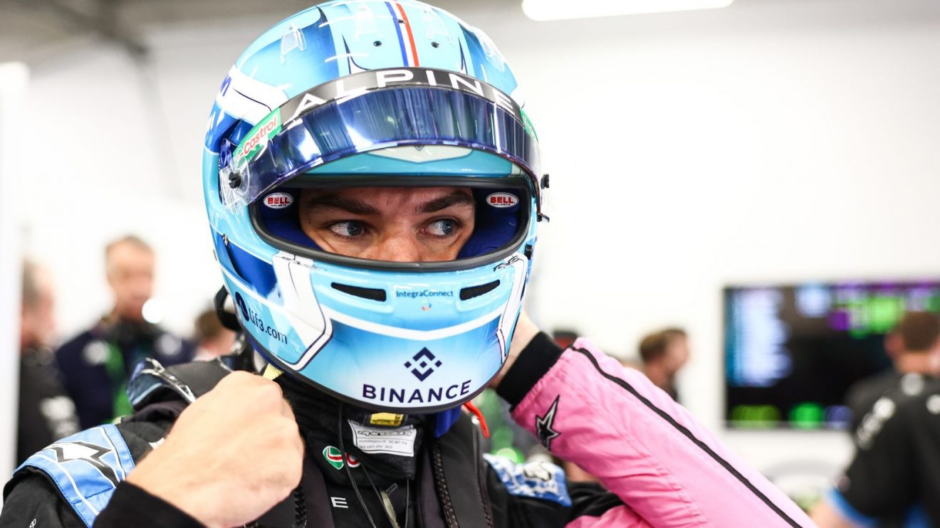 Alpine driver Pierre Gasly puts on his helmet