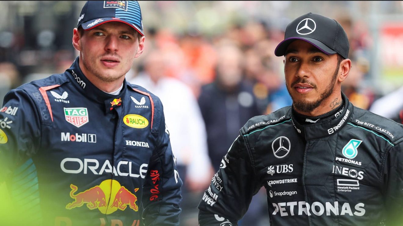 Max Verstappen and Lewis Hamilton stand alongside each other in conversation in parc ferme in China