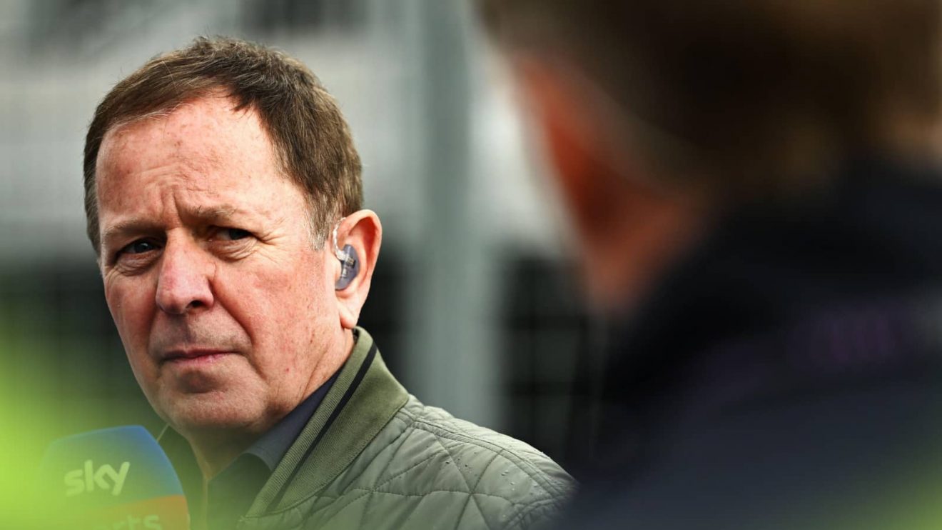 Martin Brundle looks at a colleague while on duty for Sky F1 at the Canadian Grand Prix