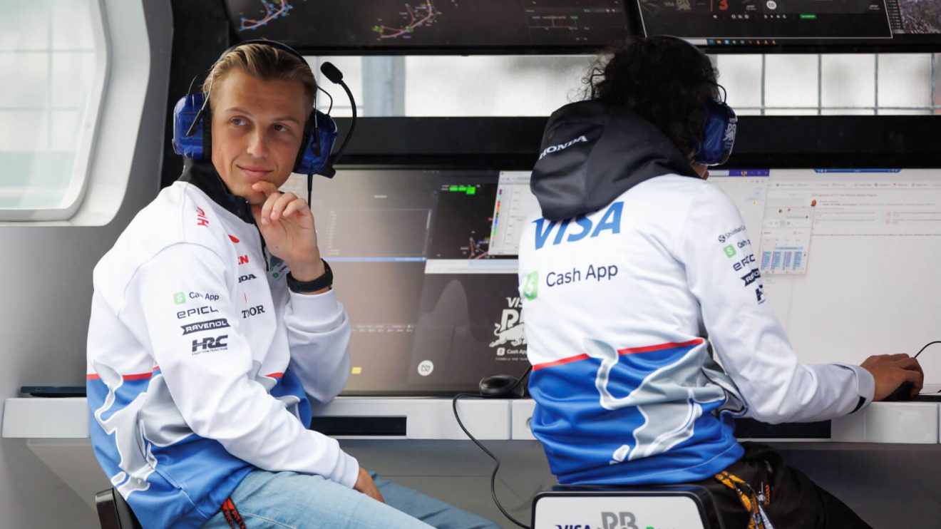 Liam Lawson sitting on the RB pit wall