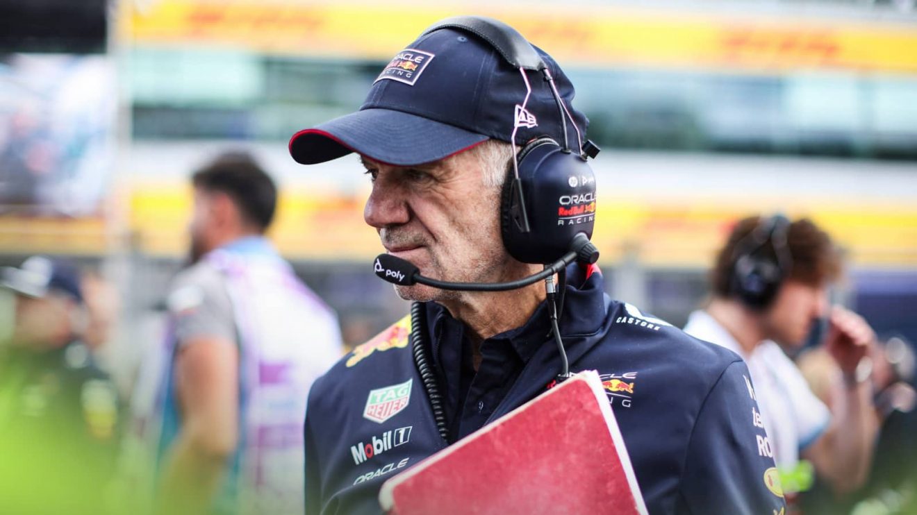 Adrian Newey clutching his notebook on the grid at Silverstone
