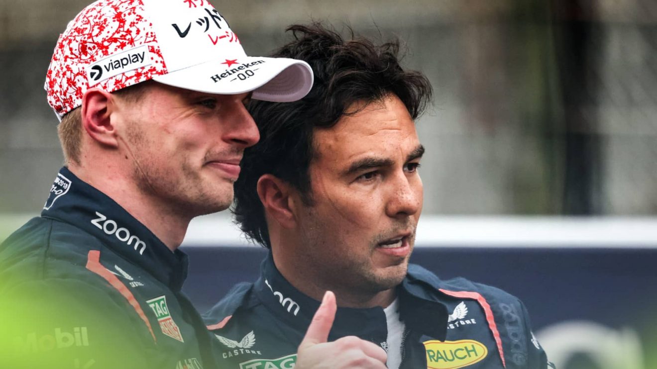 Max Verstappen poses with a thumbs up for the camera as a frustrated Sergio Perez looks on