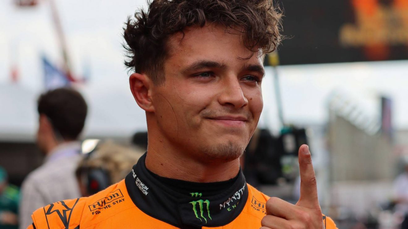 McLaren's Lando Norris celebrates with the 'number 1' finger after taking pole for the 2024 Dutch Grand Prix.