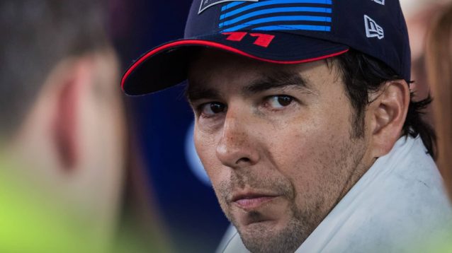 Sergio Perez looks on nervously as he faces the media
