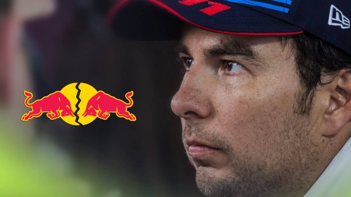 A close-up shot of Sergio Perez looking tense with a cracked Red Bull logo alongside him