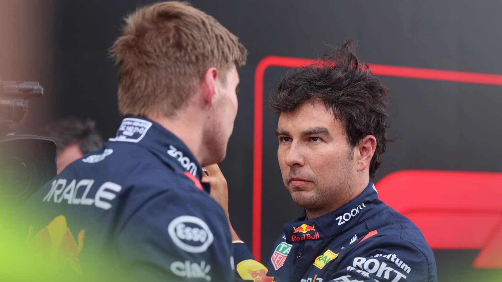 Sergio Perez looks directly at Max Verstappen in parc ferme at Zandvoort