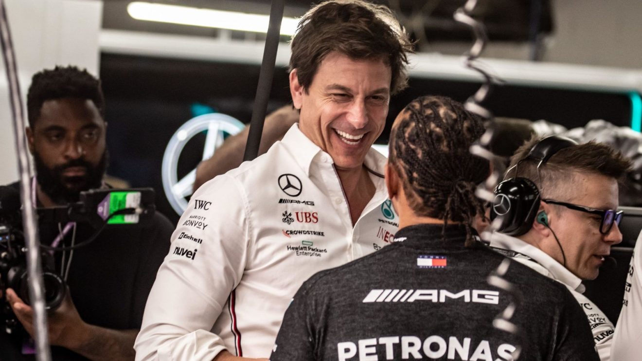 Toto Wolff smiles at Lewis Hamilton in the Mercedes garage at the 2023 Spanish Grand Prix