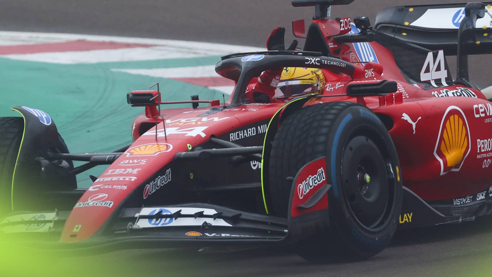 Lewis Hamilton waves to the crowd during his first test for Ferrari at Fiorano