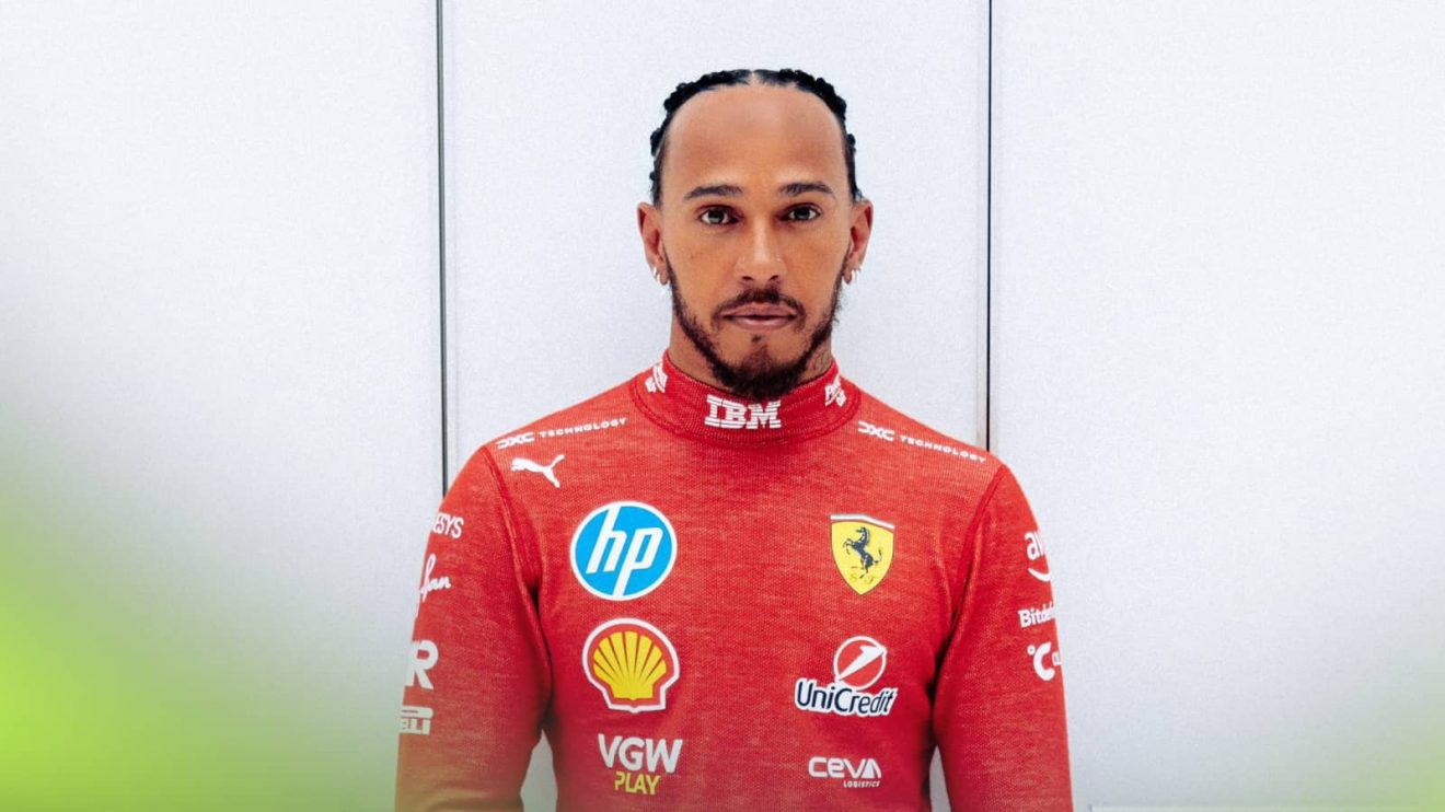 Lewis Hamilton poses in his new Ferrari race wear for F1 2025