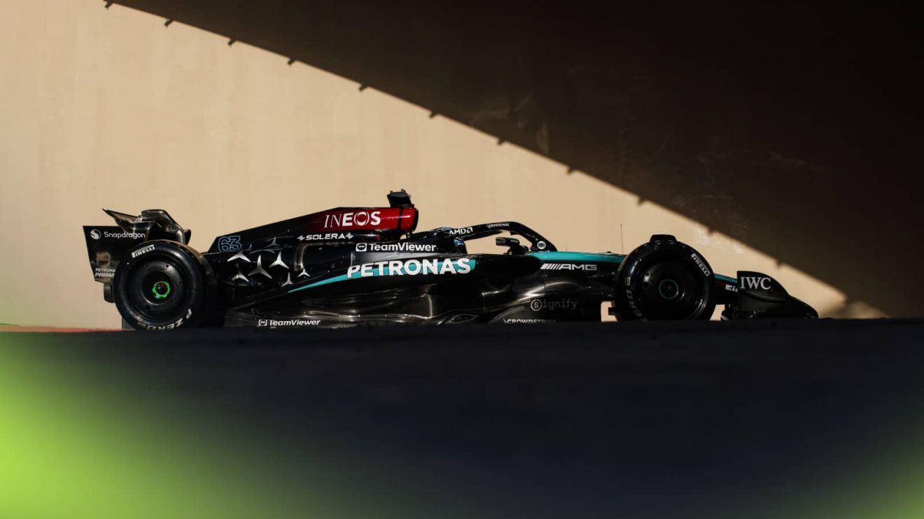 George Russell's Mercedes entering the tunnel in Abu Dhabi with a dramatic shadow effect