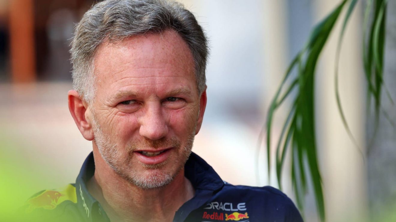 Christian Horner pictured mid-conversation in the paddock