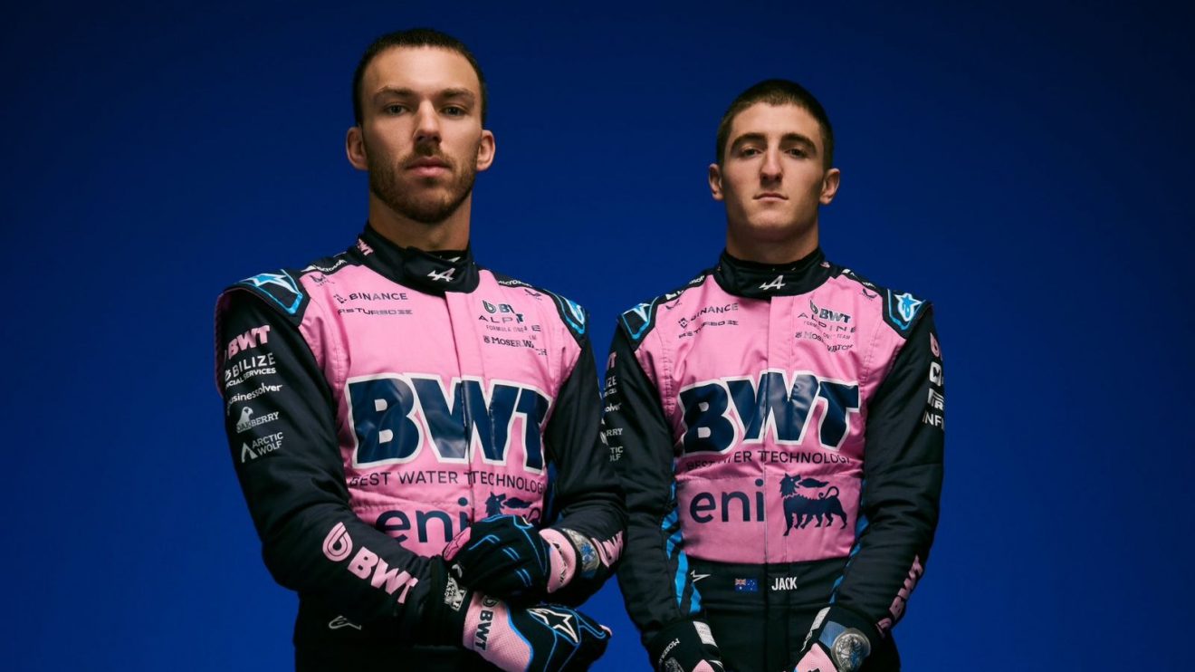 Pierre Gasly and Jack Doohan pose wearing Alpine's F1 2025 race overalls