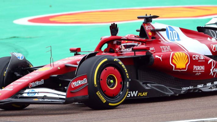 Charles Leclerc waves at the Tifosi on his first lap in the Ferrari SF-25