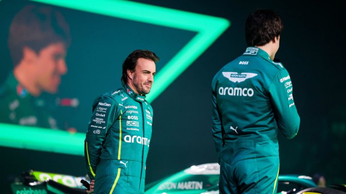 Fernando Alonso and Lance Stroll on stage at the F1 75 livery event