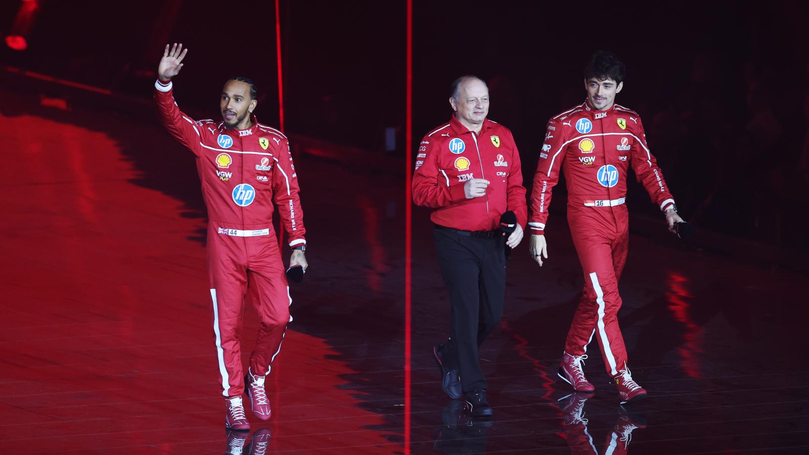 Ferrari team principal Fred Vasseur walks out with Lewis Hamilton and Charles Leclerc.
