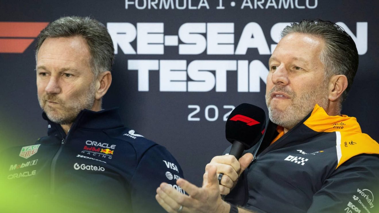 Christian Horner pulls a face as Zak Brown speaks in a press conference