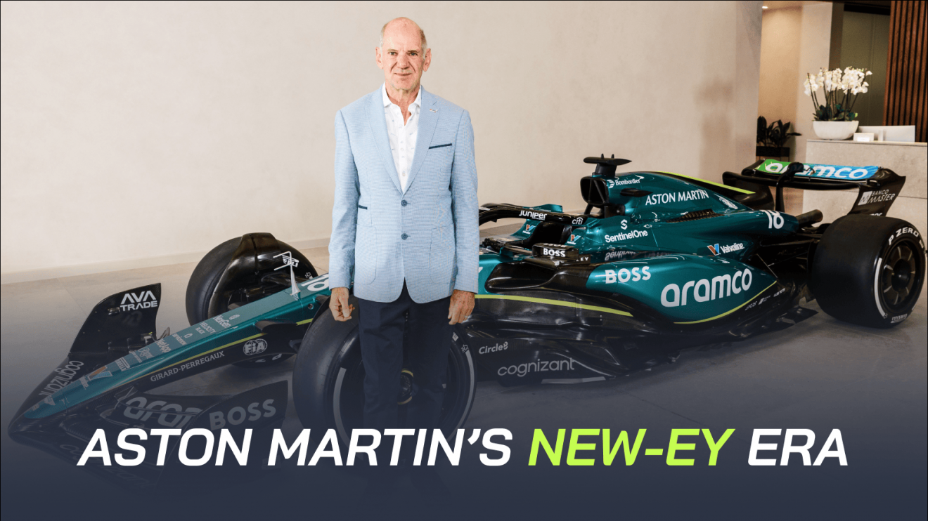 Adrian Newey poses in front of an Aston Martin F1 car with a banner reading: 'Aston Martin's New-ey era'