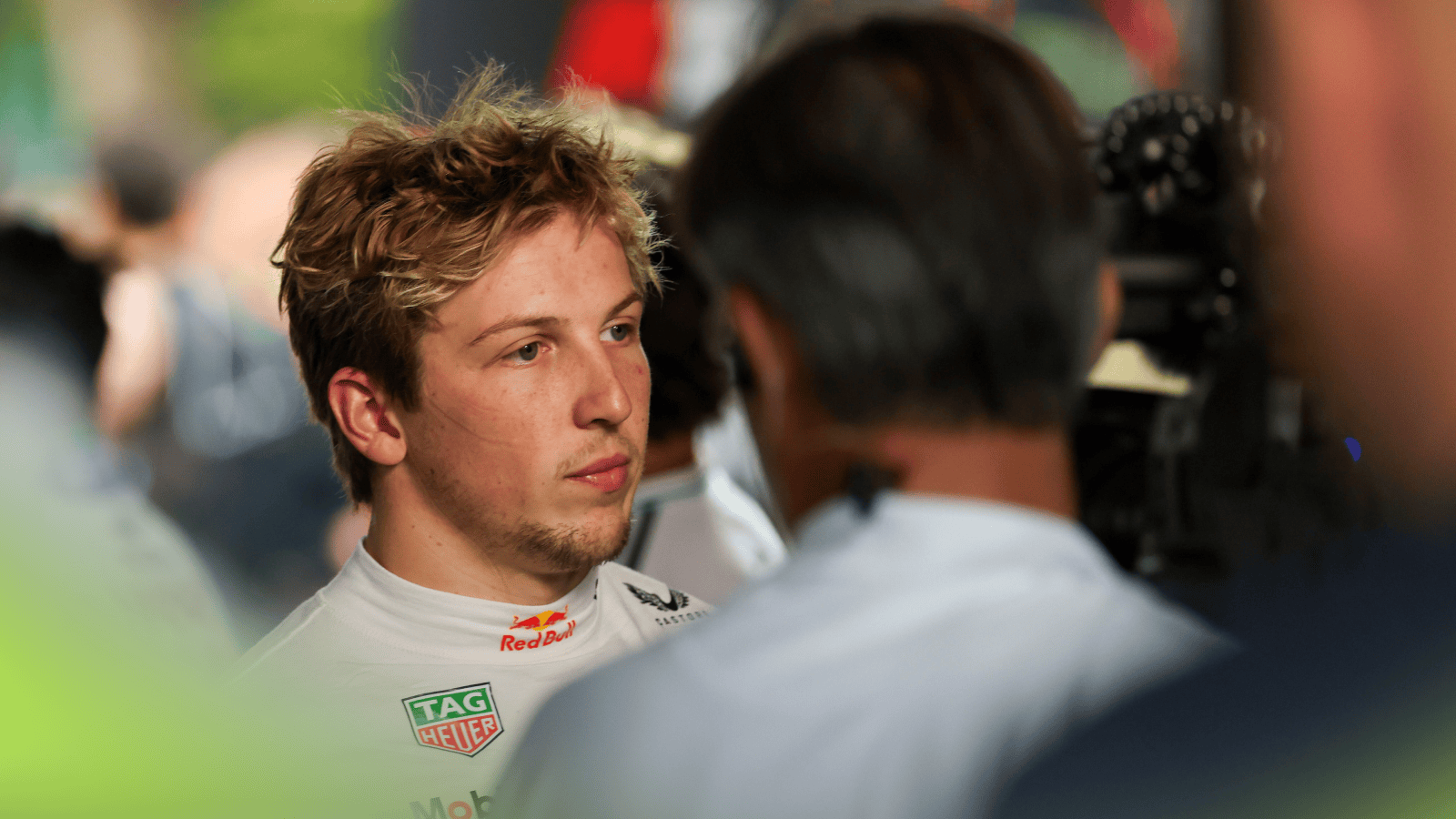 Liam Lawson looks downbeat as he faces the media