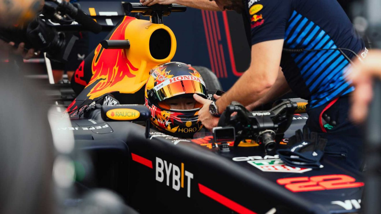 Yuki Tsunoda sits in a Red Bull cockpit.