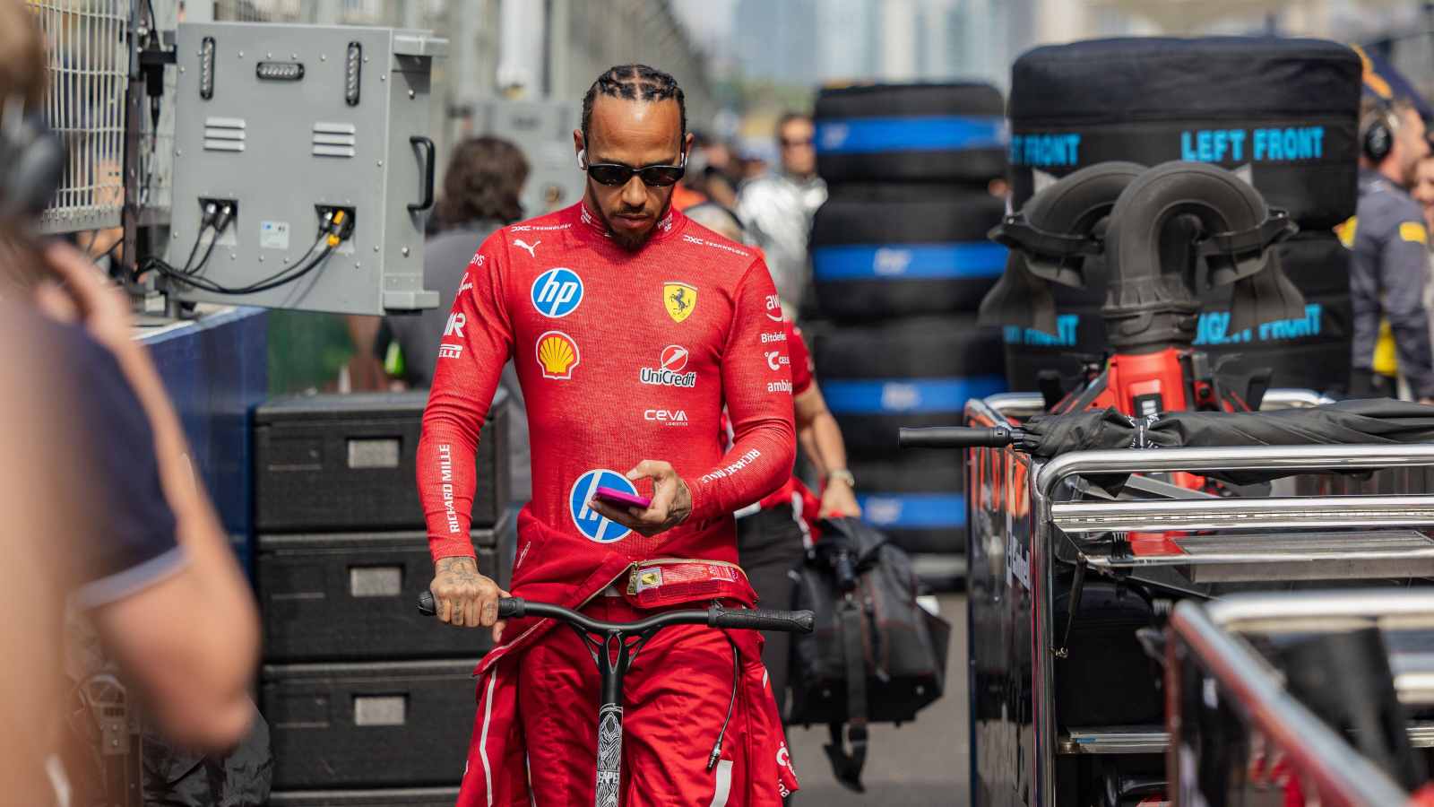 Lewis Hamilton, Ferrari, walks through the paddock.