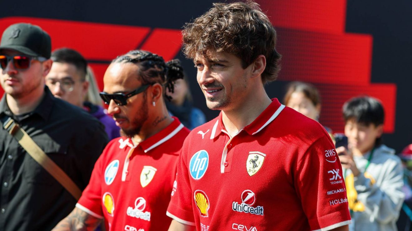Ferrari team-mates Charles Leclerc and Lewis Hamilton walk through the paddock at the 2025 Chinese Grand Prix