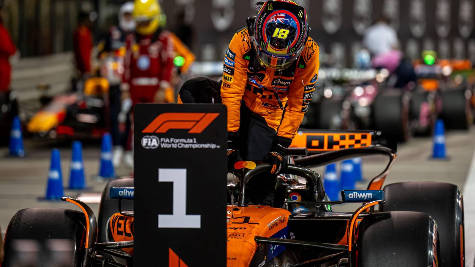 McLaren's Oscar Piastri in front of the '1' sign after taking 2025 Bahrain Grand Prix pole