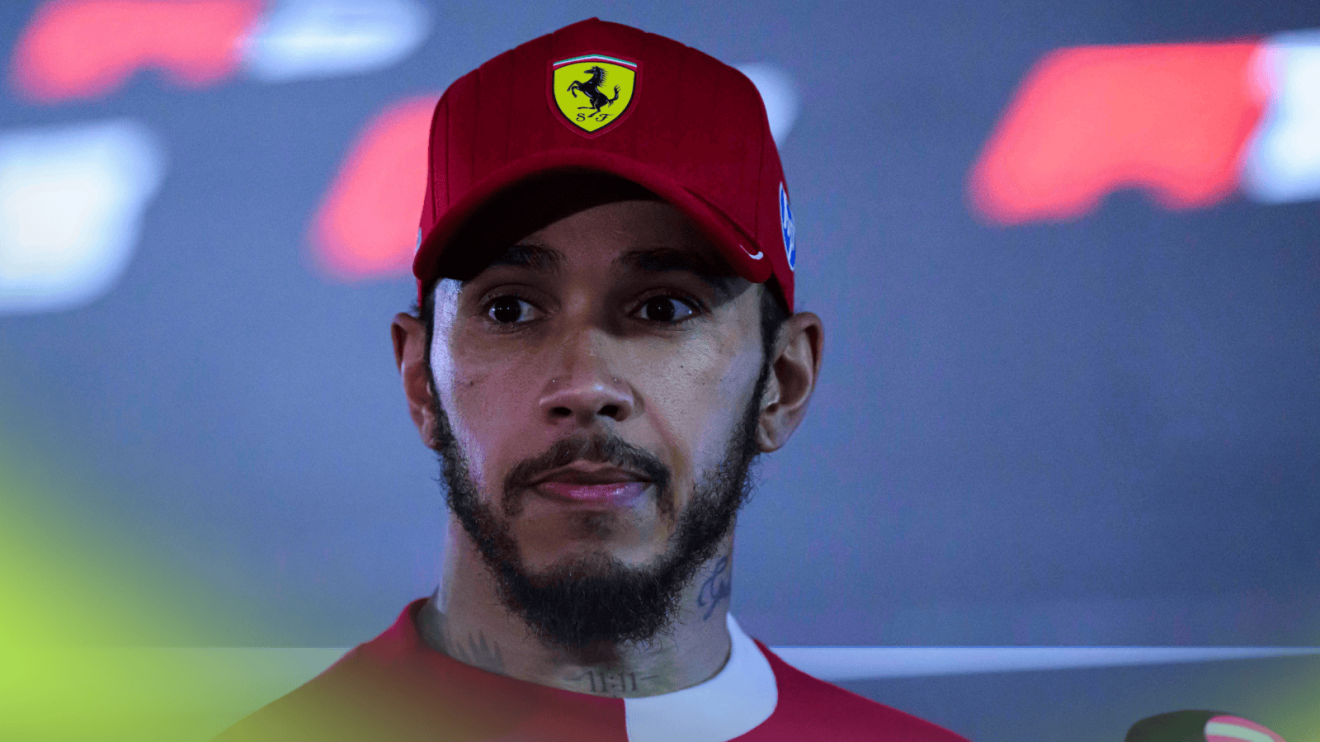Lewis Hamilton looks tense as he faces the media