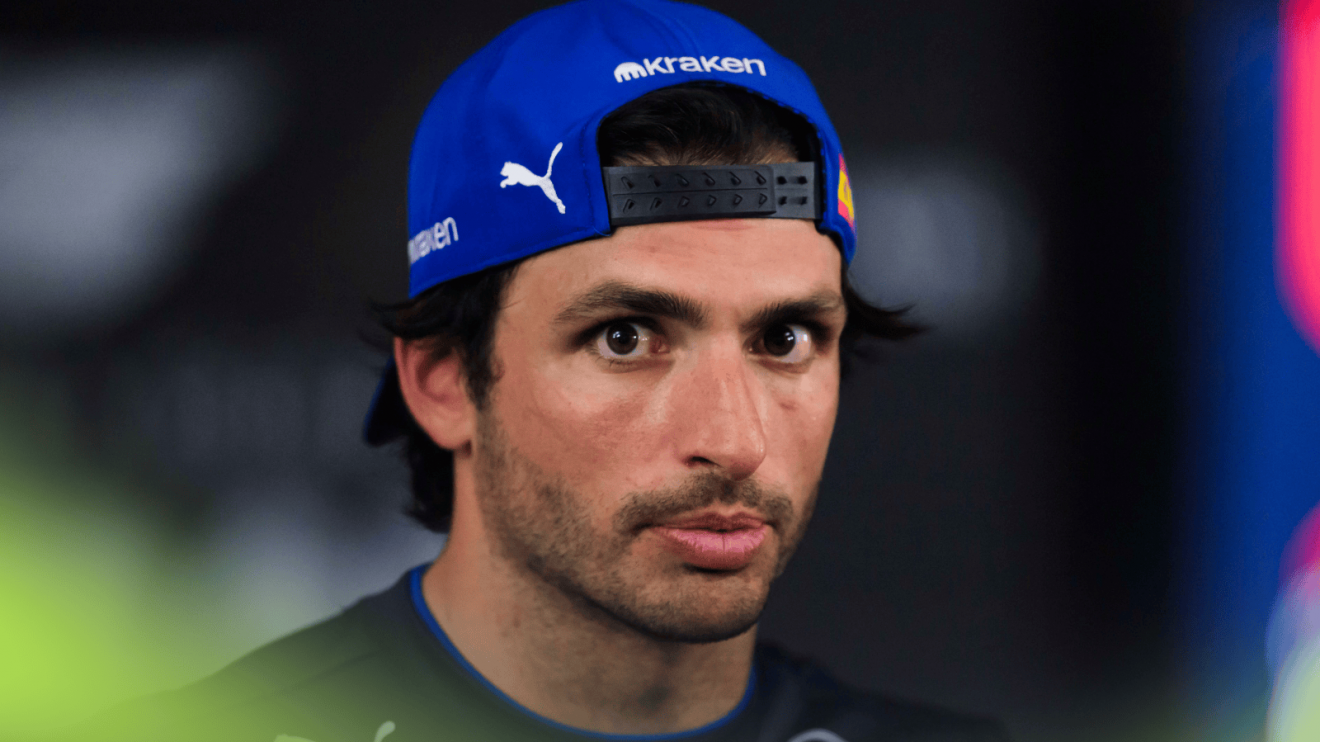 Carlos Sainz eyes the camera as he faces the media in Bahrain