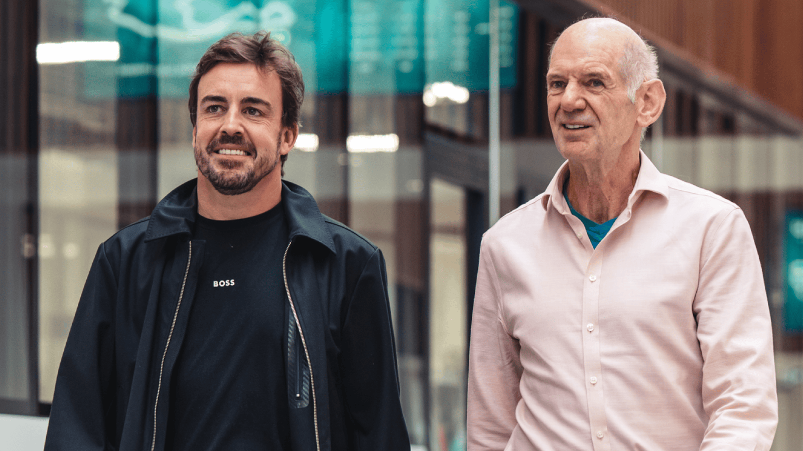 Fernando Alonso and Adrian Newey walking side by side in the Aston Martin factory