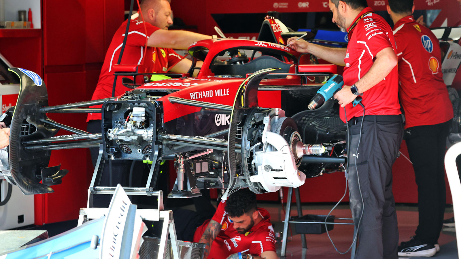 Ferrari mechanics prepare the car for action