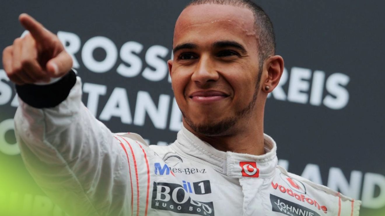 Lewis Hamilton of McLaren celebrates victory at the 2011 German Grand Prix