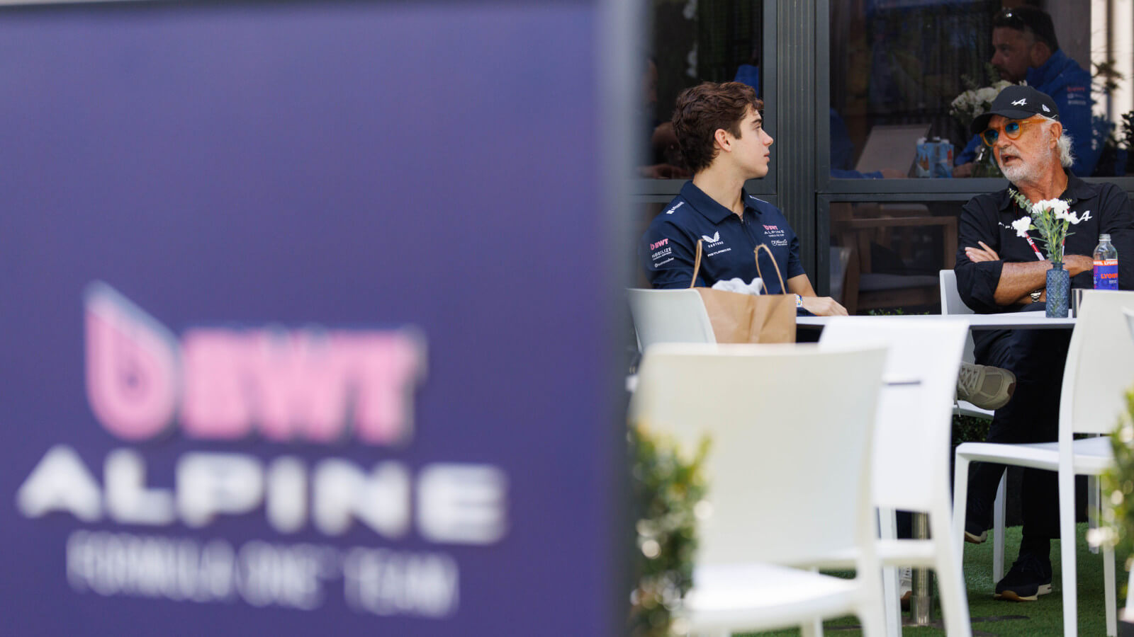 Franco Colapinto speaking with Flavio Briatore