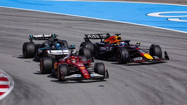 Charles Leclerc, Max Verstappen, and George Russell battle in Turn 1 during the Spanish Grand Prix.