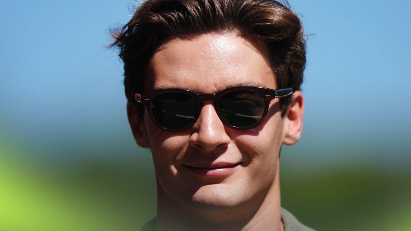 Mercedes driver George Russell enters the paddock at the 2025 Spanish Grand Prix