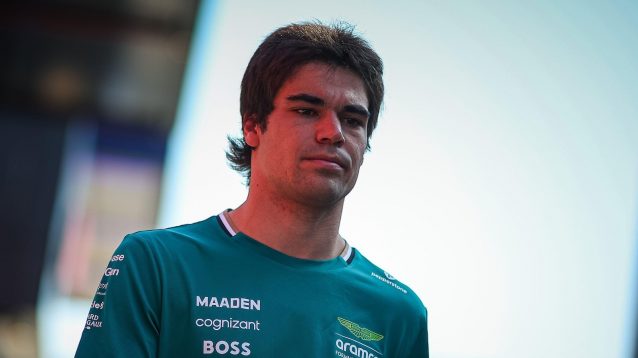 Lance Stroll walks through the paddock prior to his withdrawal from the Spanish Grand Prix.
