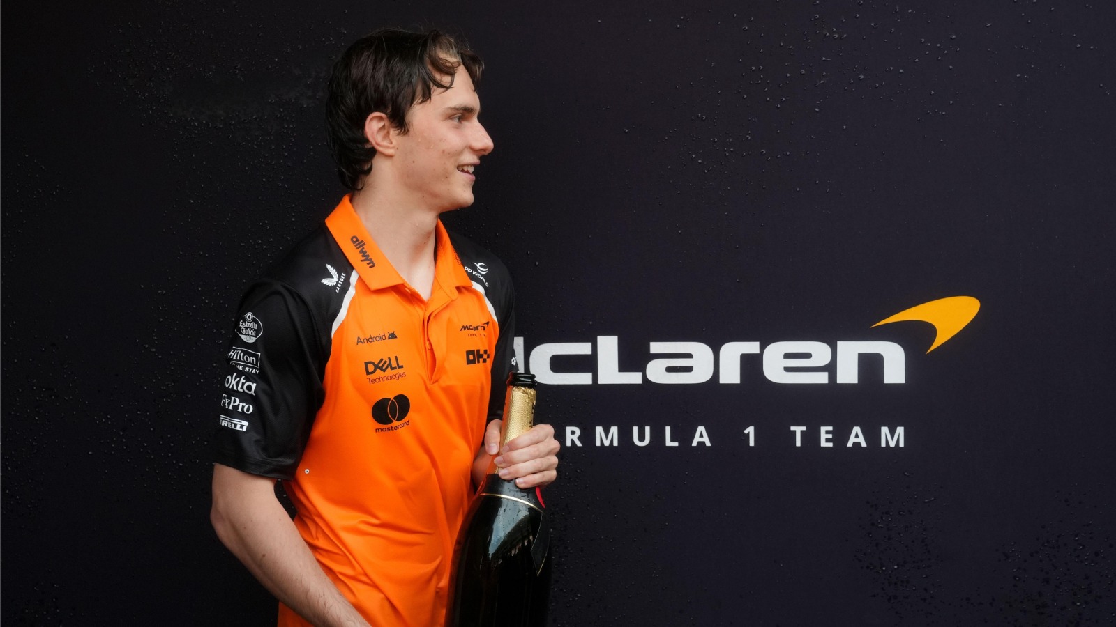 Oscar Piastri celebrates with the trophy after the race at the Circuit de Barcelona-Catalunya