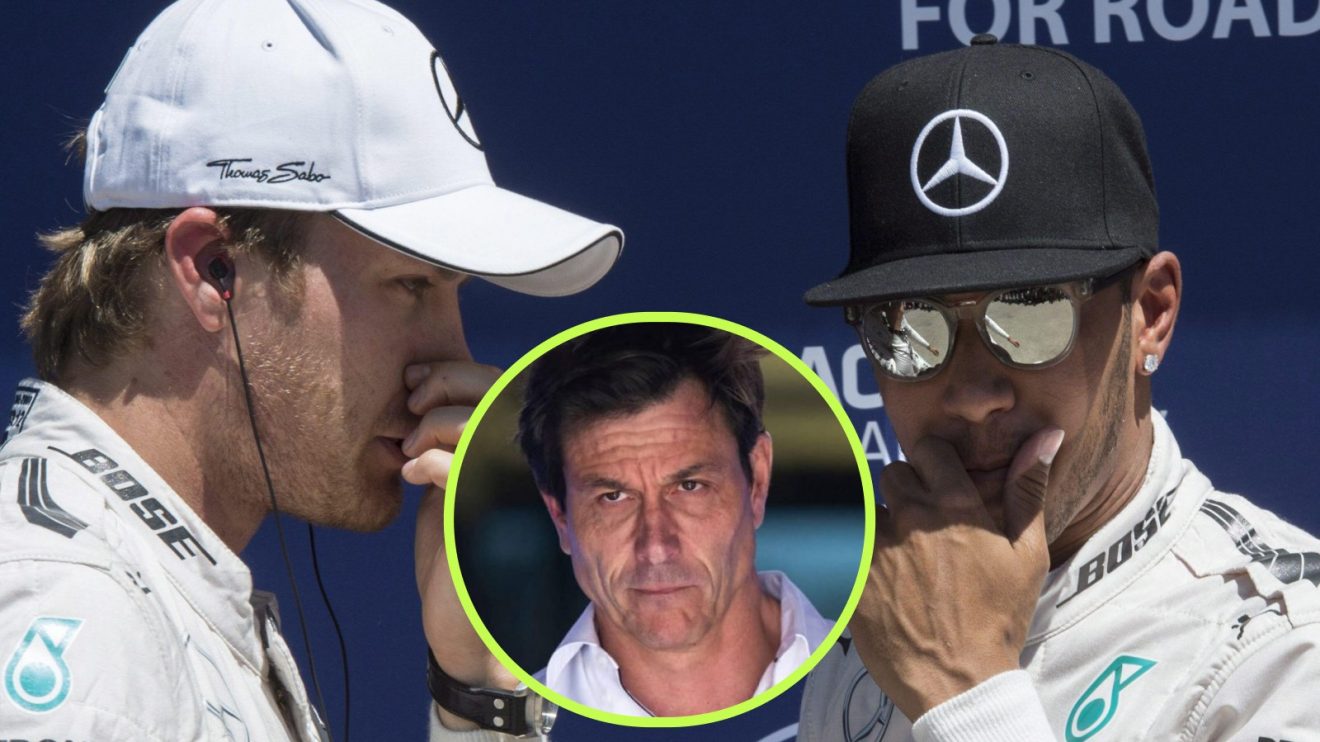 Lewis Hamilton and Nico Rosberg, Mercedes, with a hand to their mouth, and Mercedes team principal Toto Wolff in a central circle